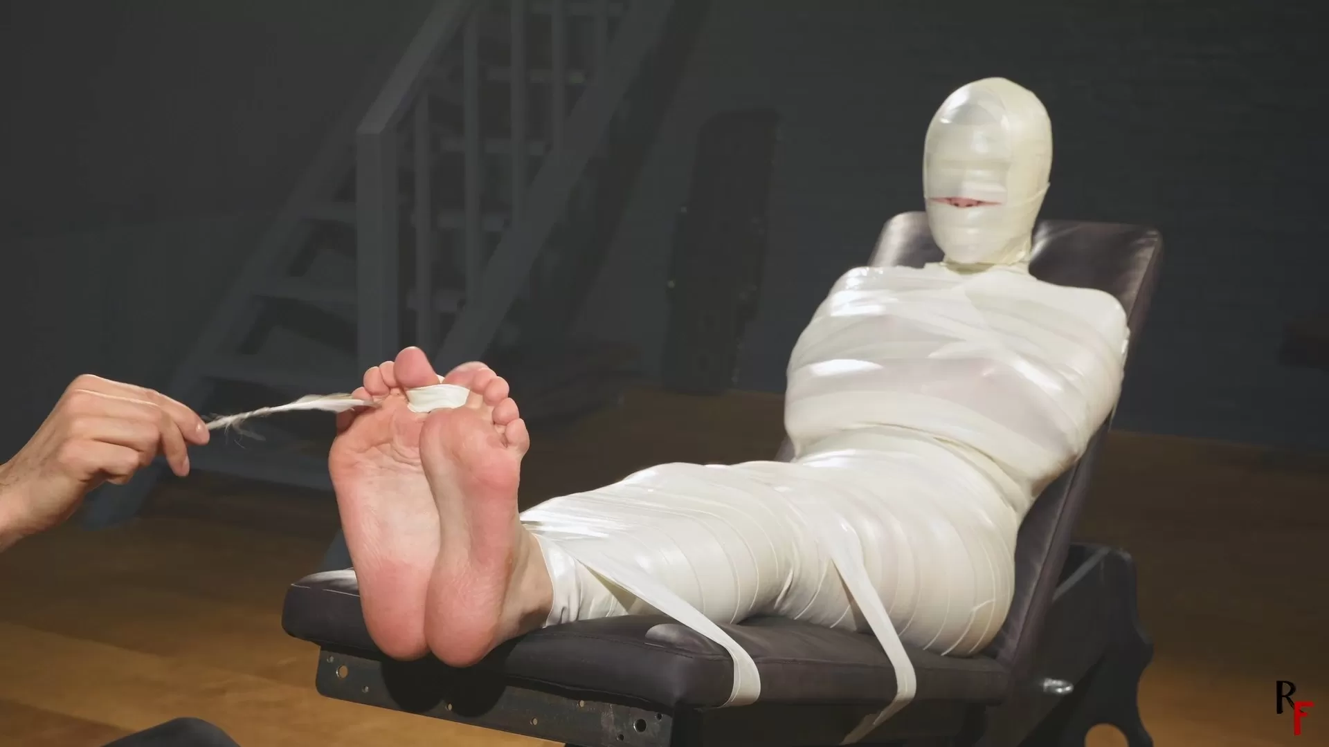 RFStudioProduction – Astrid in a Sleek Microfoam Cocoon Part 4 – Foot Tickling.webp